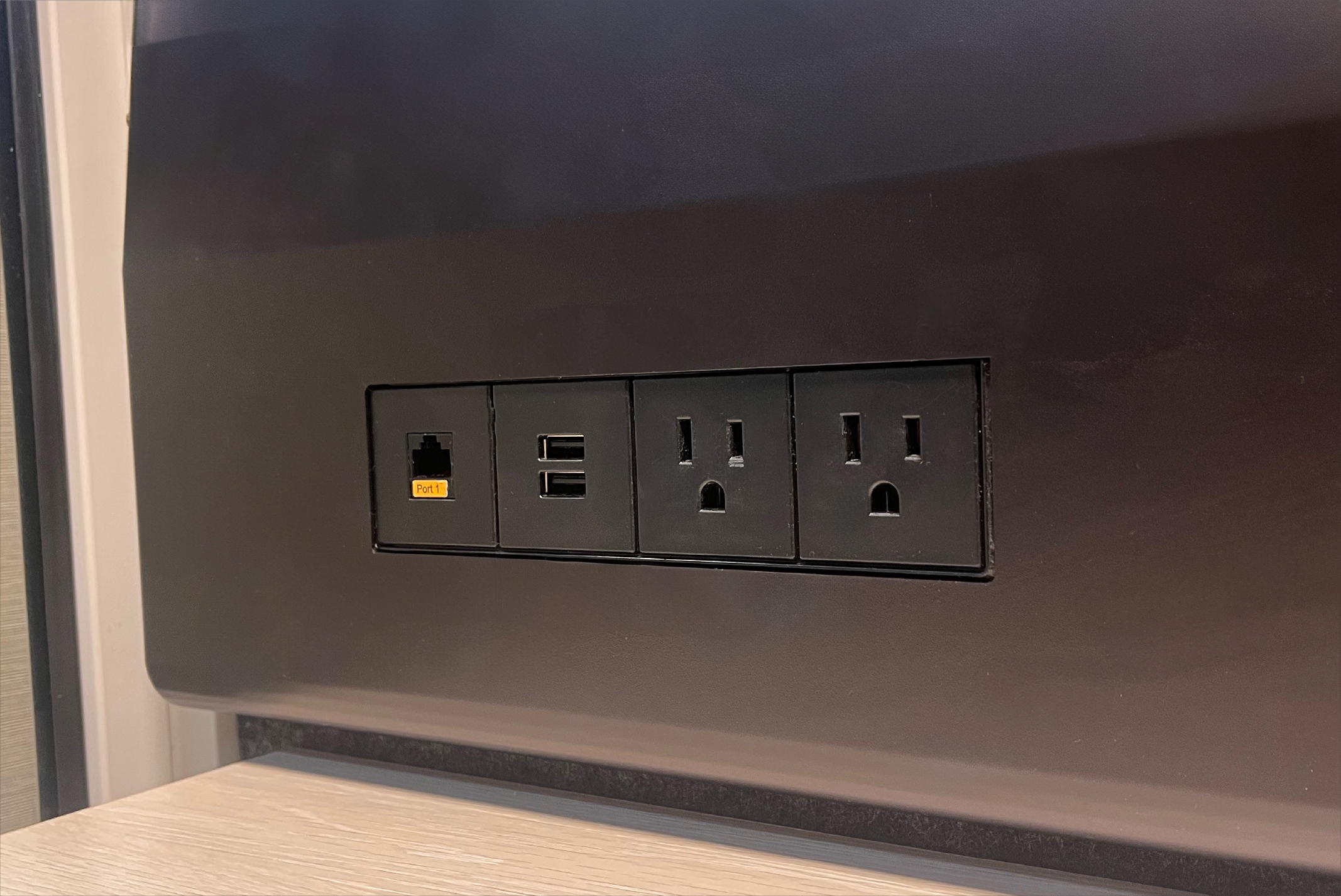 Built-in ethernet, USB, and electrical outlets.